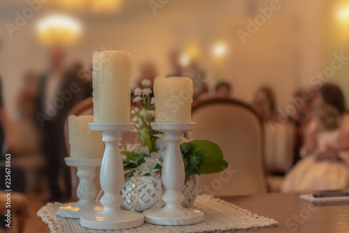 The table in the official office is decorated with candles for the wedding. Concept: wedding and ceremony