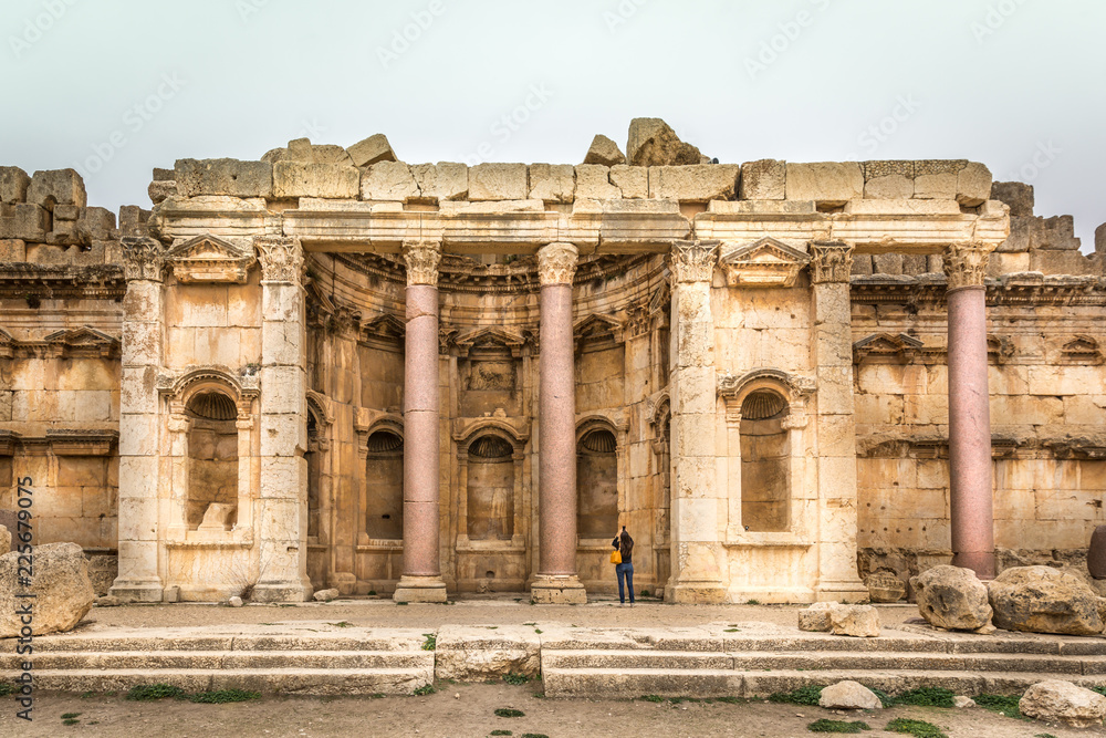 Tourist enjoying the amazing view of the rome ruins of Balbek in Lebanon