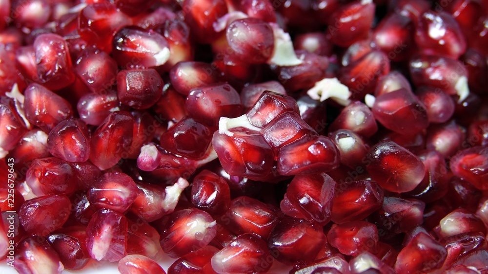 pomegranate seeds on a white background pomegranate seeds on a white background