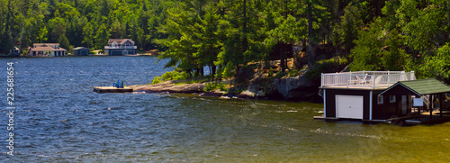 Boathouses on lake in panoramic view
