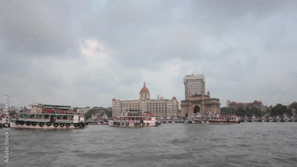 Shot of Mumbai landmarks - Gateway of India, The Taj Mahal Hotel from a speed boat Shot of Mumbai landmarks - Gateway of India, The Taj Mahal Hotel from a speed boat