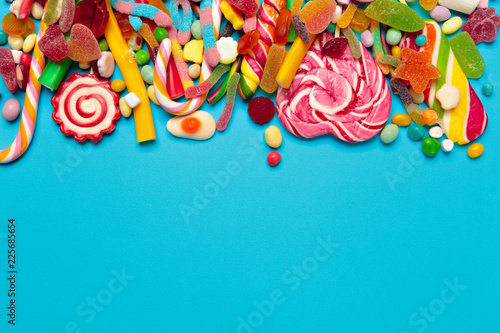 colored candies on blue background