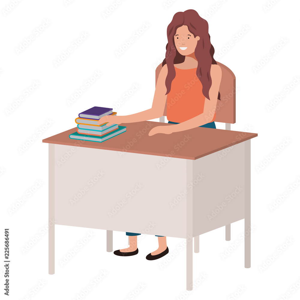 woman sitting in school chair and desk reading book woman sitting in school chair and desk reading book