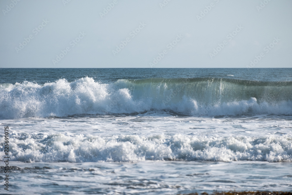 Wave crashing on coastline