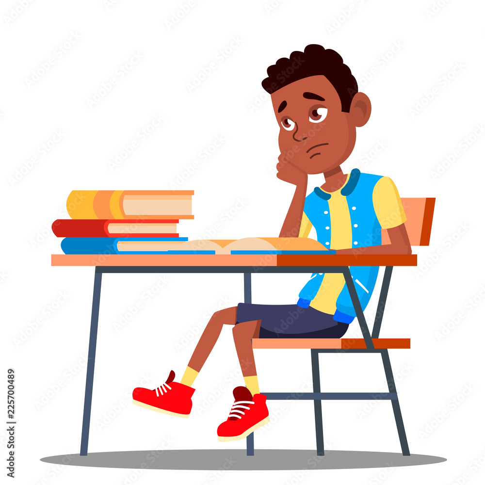 Sad Child Sitting At A Desk In The Classroom Vector. School. Education. Isolated Illustration Sad Child Sitting At A Desk In The Classroom Vector. School. Education. Isolated Illustration