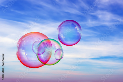 Colored soap bubbles against the sky. Sky background and bubbles.
