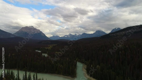 Ariel shot soaring towards the Mountains overlooking  beautiful rivers photo