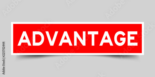 Label sticker red color in word advantage on gray background