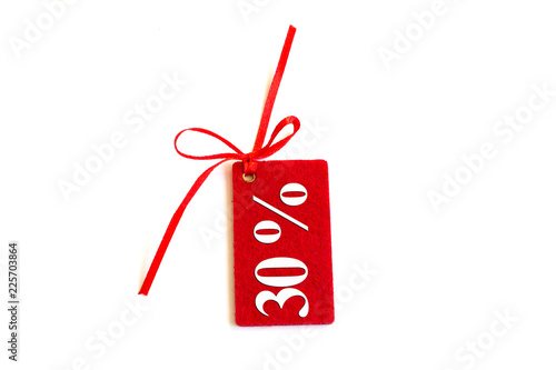 A discount red tag or label, isolated on a white background. Copy space.