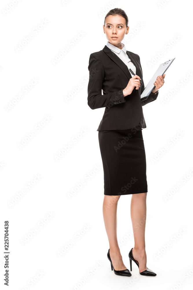 beautiful young businesswoman in suit with clipboard looking away isolated on white beautiful young businesswoman in suit with clipboard looking away isolated on white
