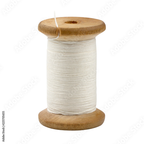 wooden spool of white thread closeup isolated on white background.