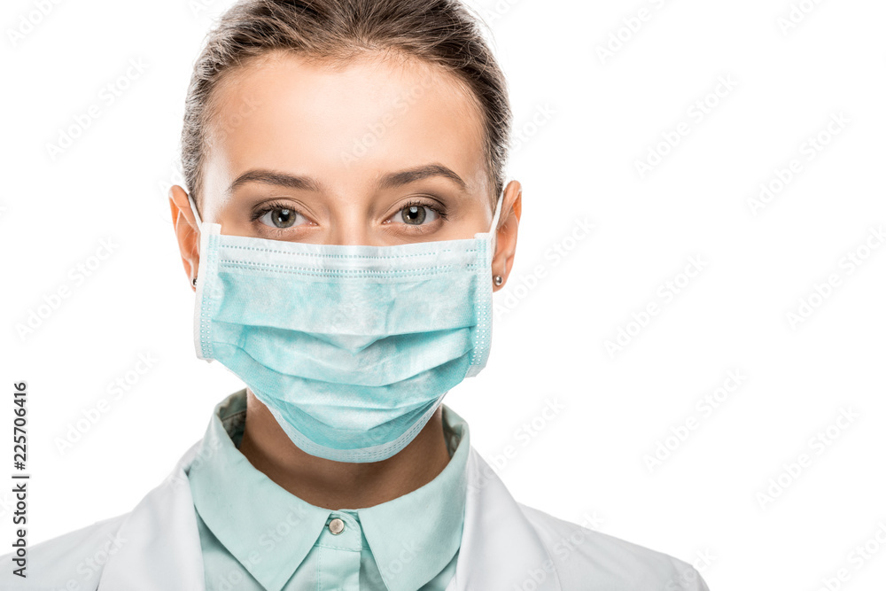 portrait of young female doctor in medical mask looking at camera isolated on white portrait of young female doctor in medical mask looking at camera isolated on white