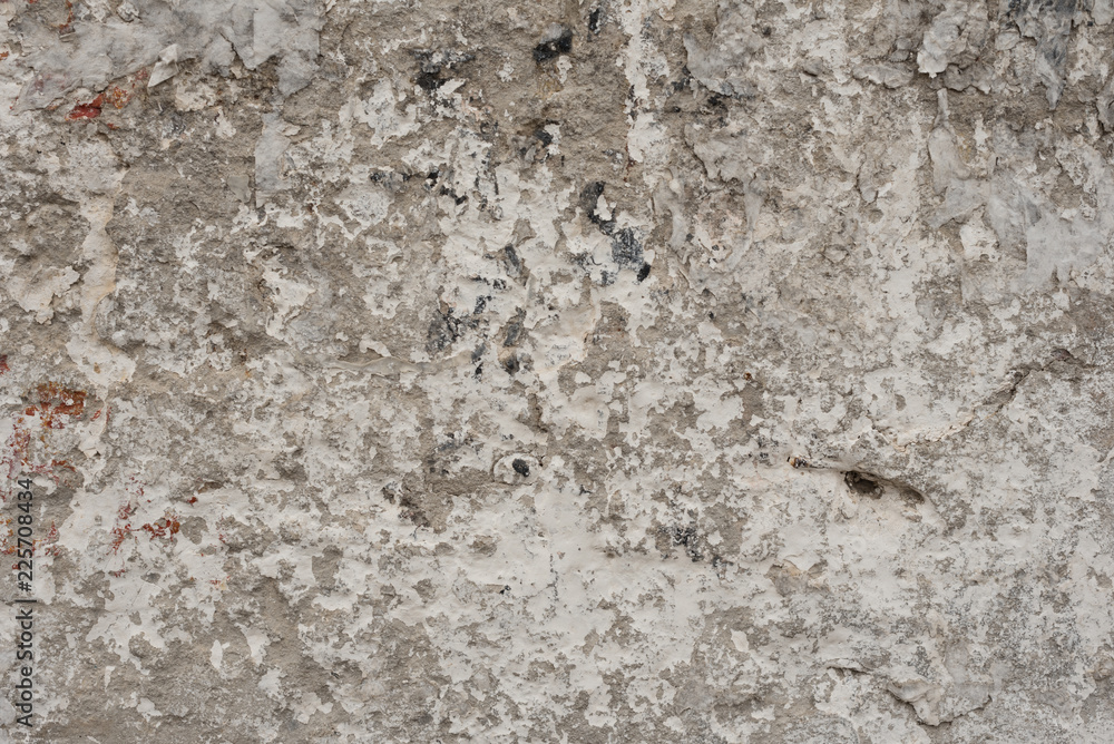 Wall fragment with scratches and cracks. It can be used as a background Wall fragment with scratches and cracks. It can be used as a background