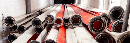 Panoramic photo of fire hoses hanging from the top drying out after the action photo