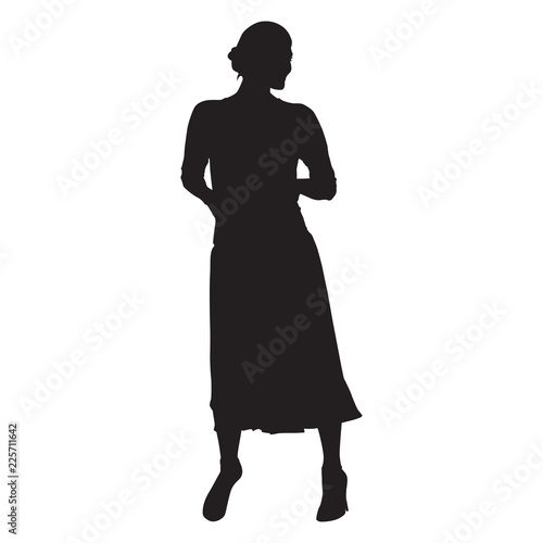 Woman standing. Long skirt, hands in pockets. Isolated vector silhouette