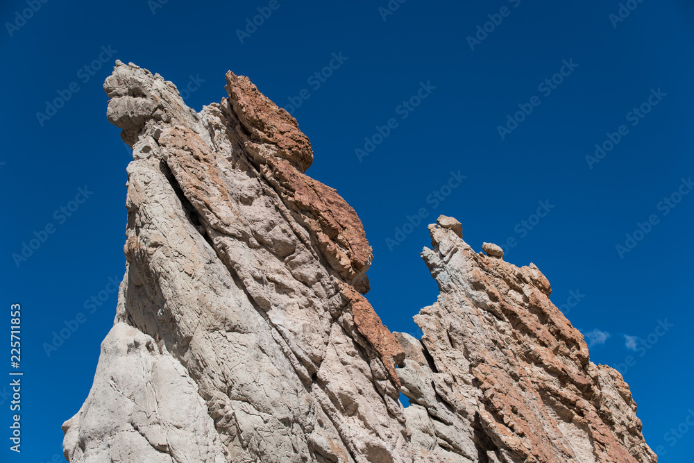 Craggy rock formations against a deep blue sky at Plaza Blanca, Abiquiu, New Mexico