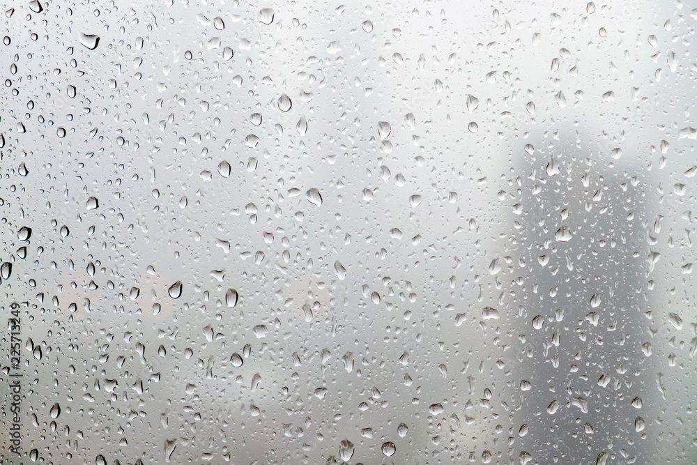 Rain drops on window glasses surface with cloudy background. Rain drops on window glasses surface with cloudy background.