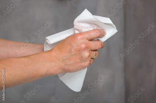 Female hands holding white towel