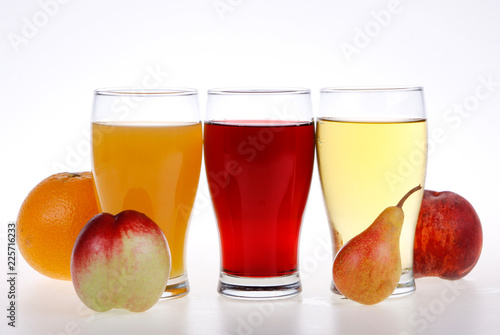 glasses of juice and fruits