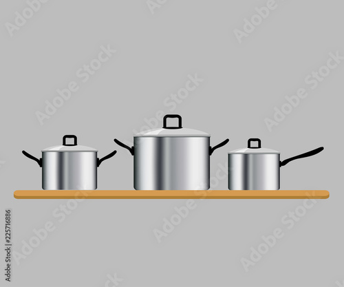 Set of three saucepans isolated on gray background