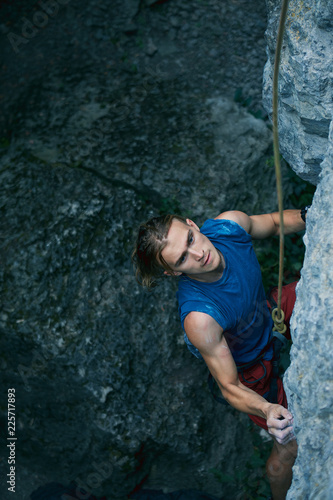 rock climbing. man rock climber climbing the challenging route on the limestone wall © vitaliymateha