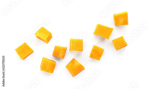 Fresh raw pumpkin pieces isolated on white, top view