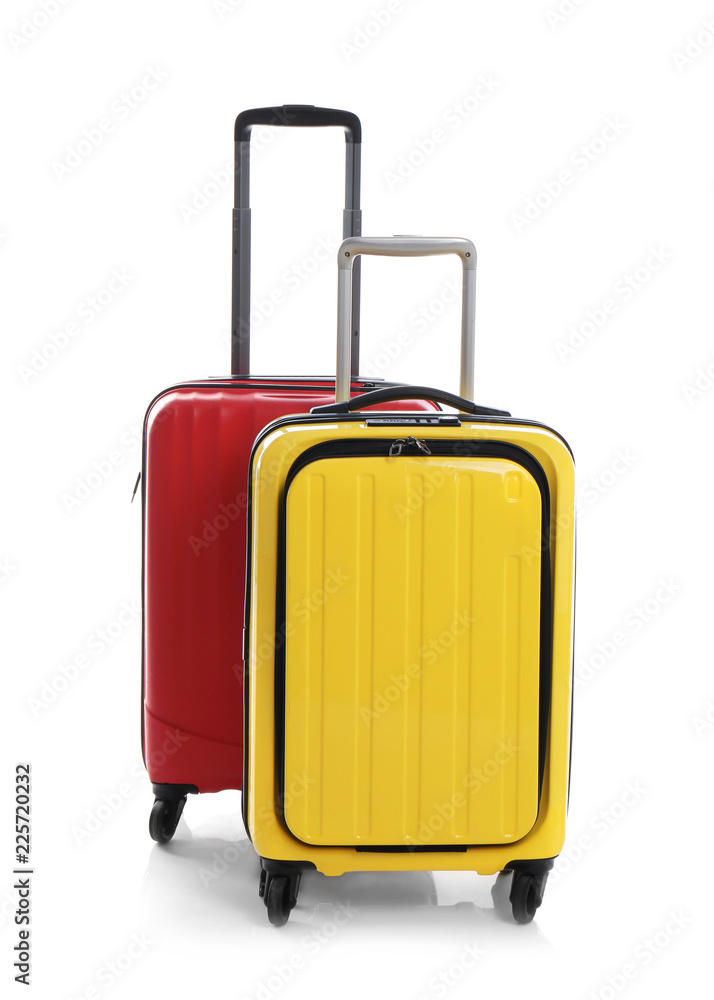 Modern suitcases for travelling on white background Modern suitcases for travelling on white background