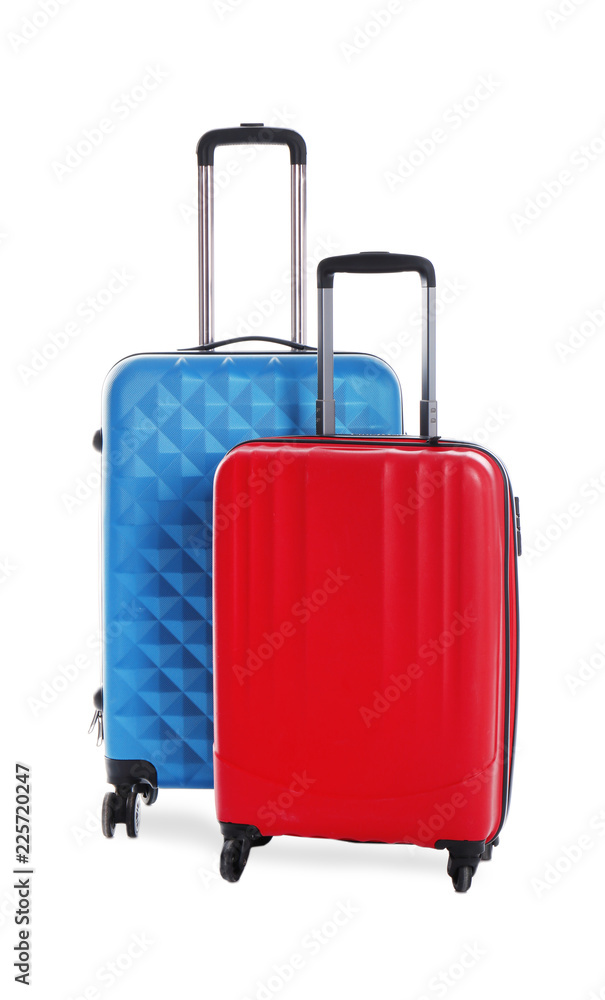 Modern suitcases for travelling on white background Modern suitcases for travelling on white background