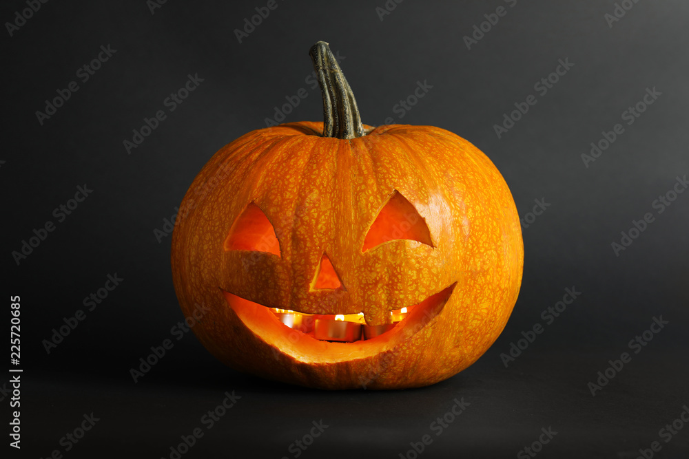 Halloween pumpkin head jack lantern on dark background Halloween pumpkin head jack lantern on dark background