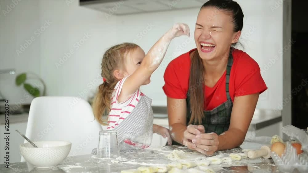 Mother and Her Sweet Daughter Are Cuddling To Each Other. They Have A Lot Of Fun Togeher. Mother and Her Sweet Daughter Are Cuddling To Each Other. They Have A Lot Of Fun Togeher.