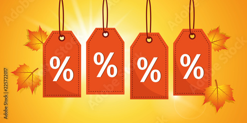 autumn sale orange percent label tags on a sunny background