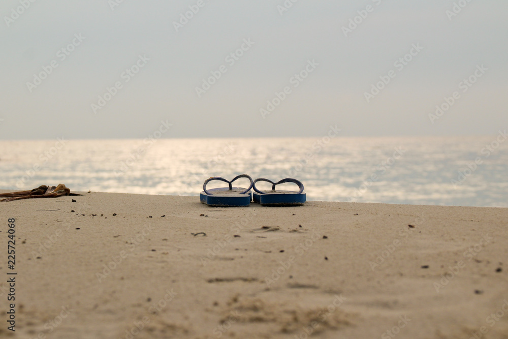 Holiday on beach concept alone Sandals Holiday on beach concept alone Sandals