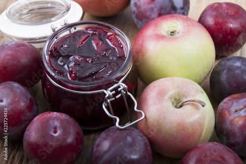 Jam from plums with apples in a glass jar
