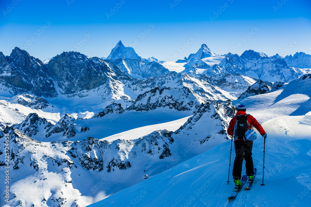 Ski with amazing view of swiss famous mountains in beautiful winter snow Mt Fort. The skituring, backcountry skiing in fresh powder snow.