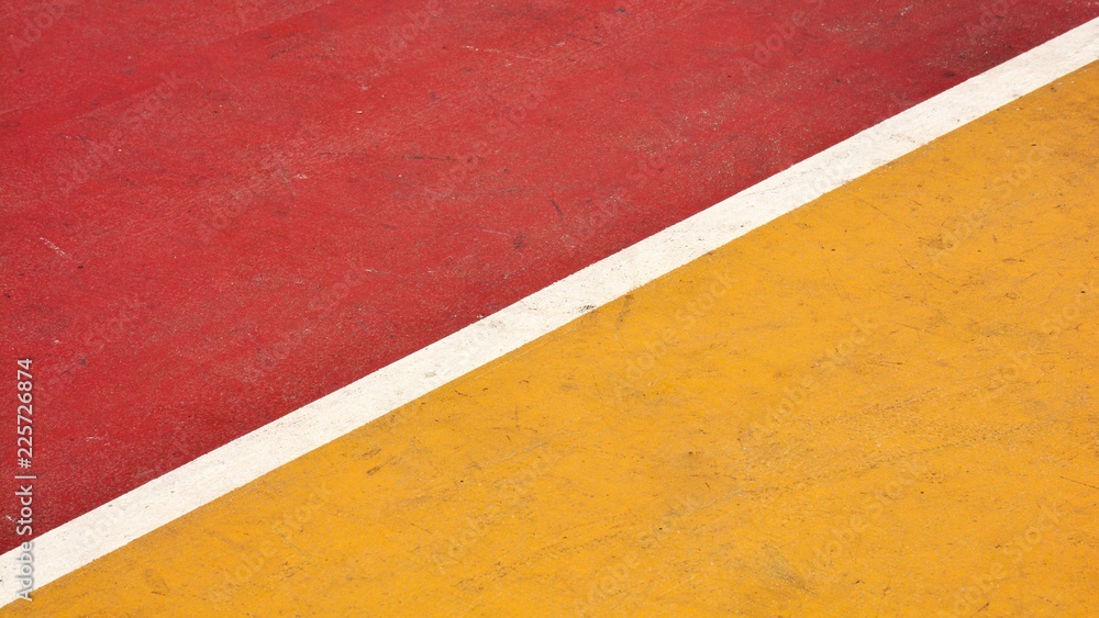 Fototapeta premium closeup red and yellow basketball court