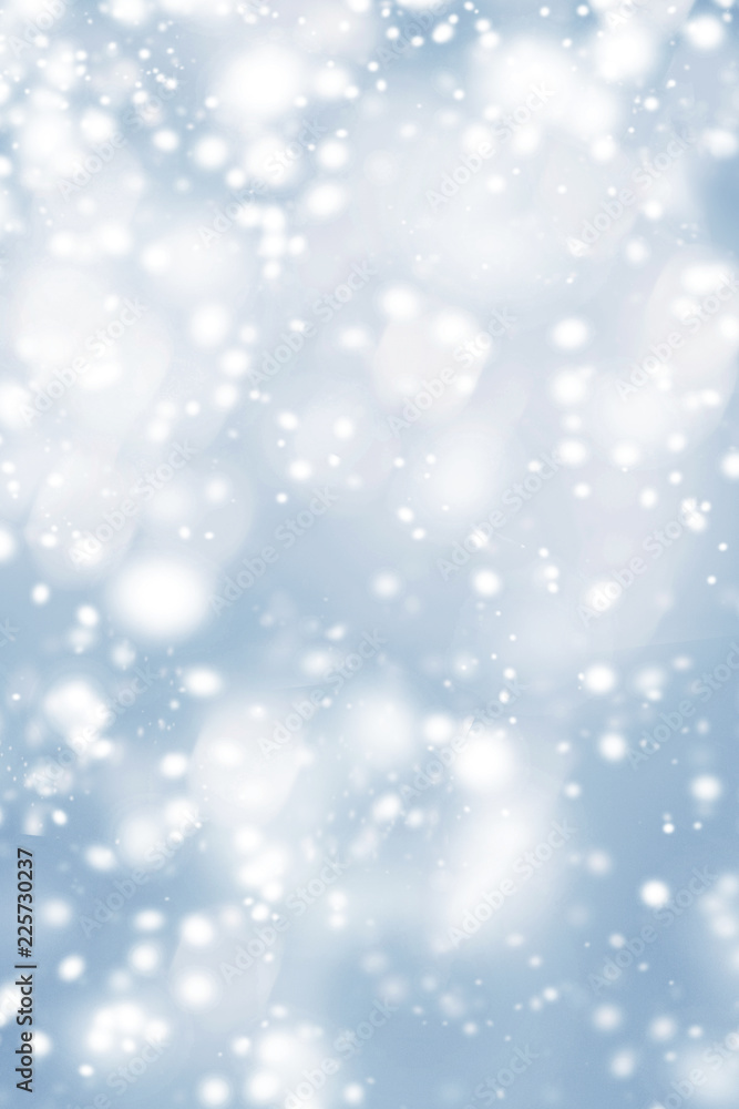 Blue Christmas  background with frosty snowflakes and   glittering bokeh stars. Abstract  Glowing blurred lights