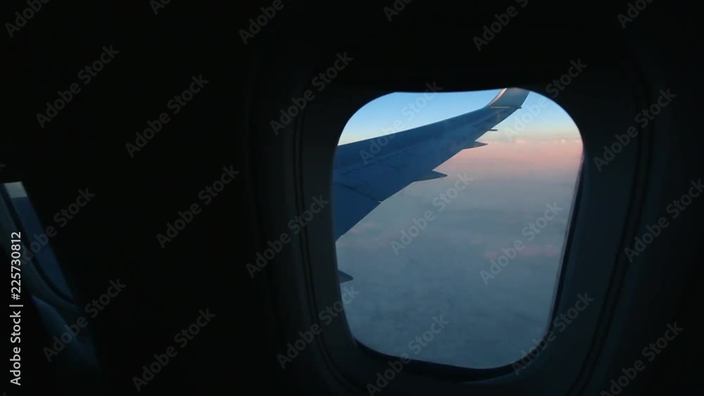 Airplane Window View at Sunset Airplane Window View at Sunset