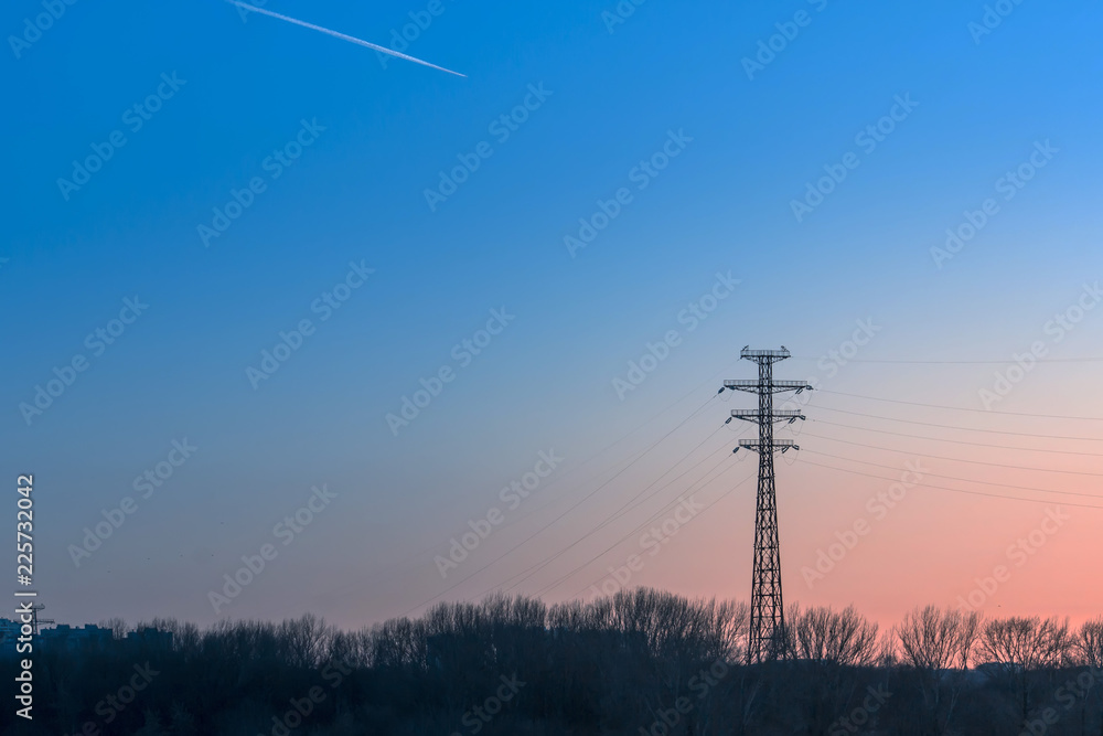 silhouette of high voltage electric tower with beautiful sky background