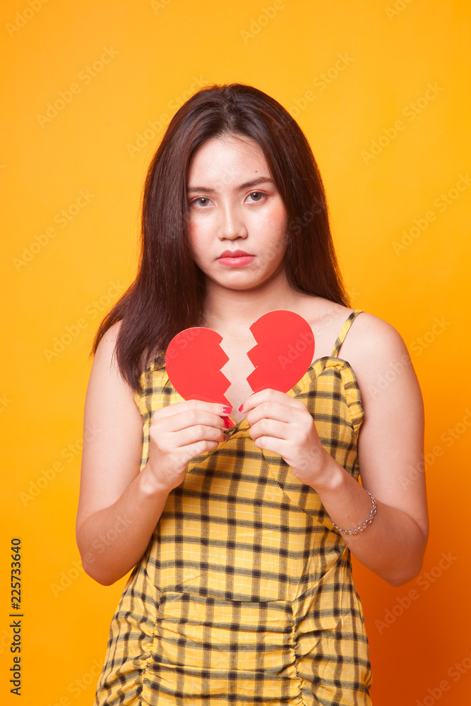 Beautiful young Asian woman with broken heart. Beautiful young Asian woman with broken heart.