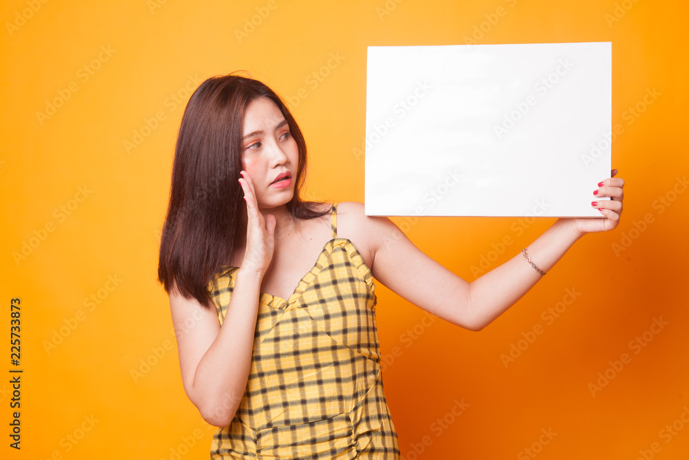 Young Asian woman surprise with white blank sign. Young Asian woman surprise with white blank sign.