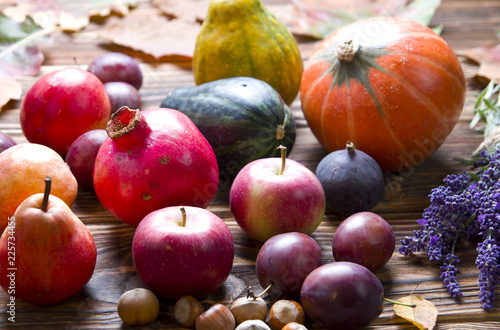 Autumn composition of fresh fruit on wood