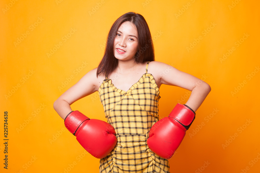 Young Asian woman with red boxing gloves. Young Asian woman with red boxing gloves.