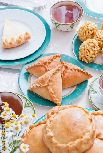 Traditional Tatar pastry - belesh, elesh, echpochmak, Chak-Chak, kystybyi, smetannik photo