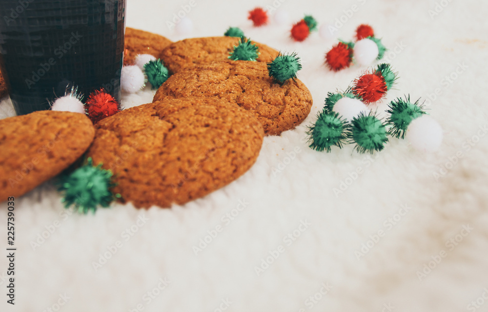 New Year and Christmas. Serpentine and garlands. Ginger and oatmeal cookies. New Year sweets. White background. Hot coffe in dark cup.