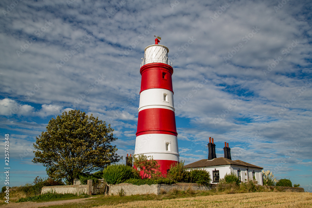 Happisburgh lighthouse situtated in Norfolk in beautiful autumnal sunshine Happisburgh lighthouse situtated in Norfolk in beautiful autumnal sunshine