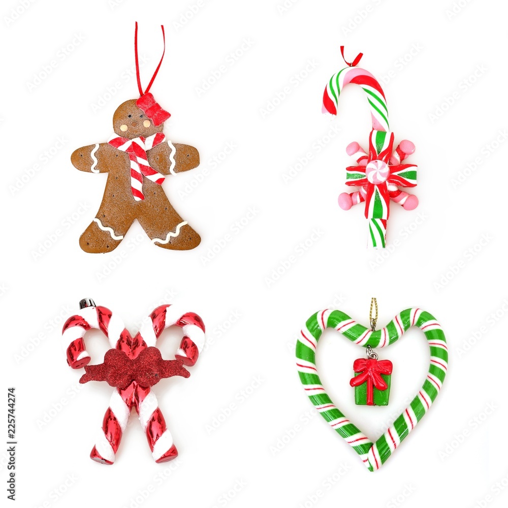Naklejka premium Christmas lollipop and Gingerbread Man isolated on white background