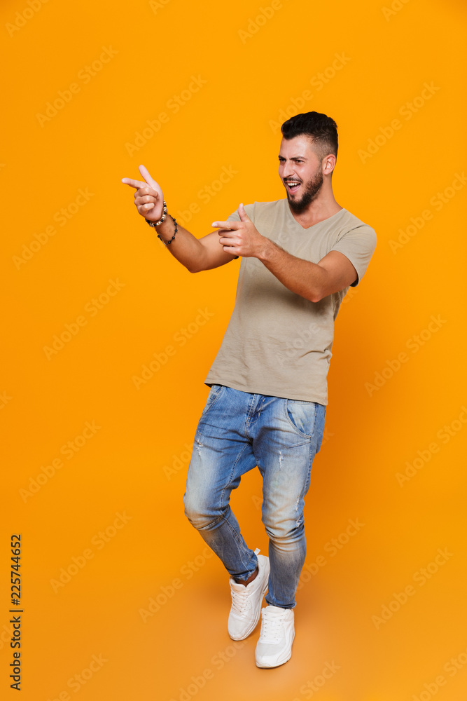 Full length portrait of a smiling young casual man Full length portrait of a smiling young casual man