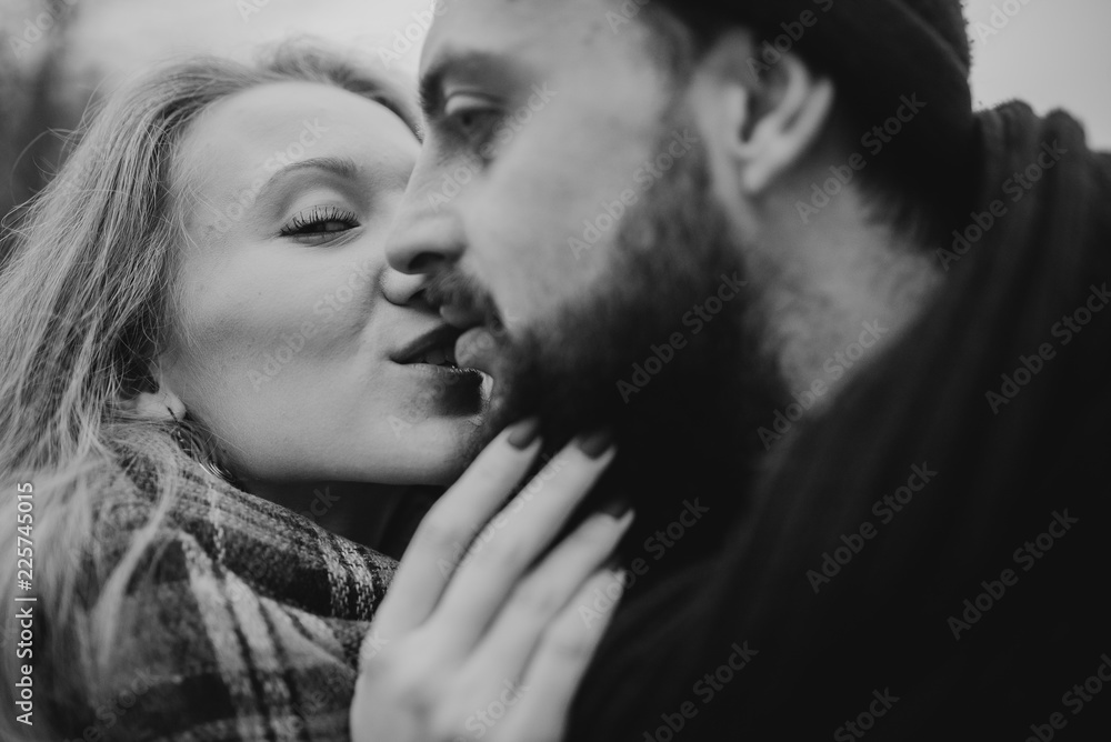 Portrait of couple. Young couple in love and fun, hug and travel in the nature. The concept of tenderness and affection. Romantic black and white photo Portrait of couple. Young couple in love and fun, hug and travel in the nature. The concept of tenderness and affection. Romantic black and white photo