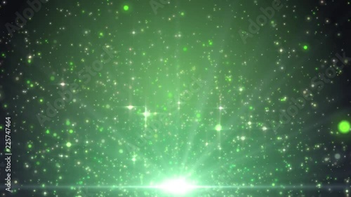 Space green background with particles. Space lime dust with stars. Sunlight of beams and gloss of particles galaxies. Seamless loop. Green screen.