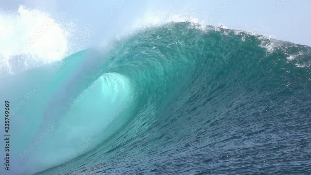 Loop of SLOW MOTION CLOSE UP: Big Teahopoo wave breaking and splashing